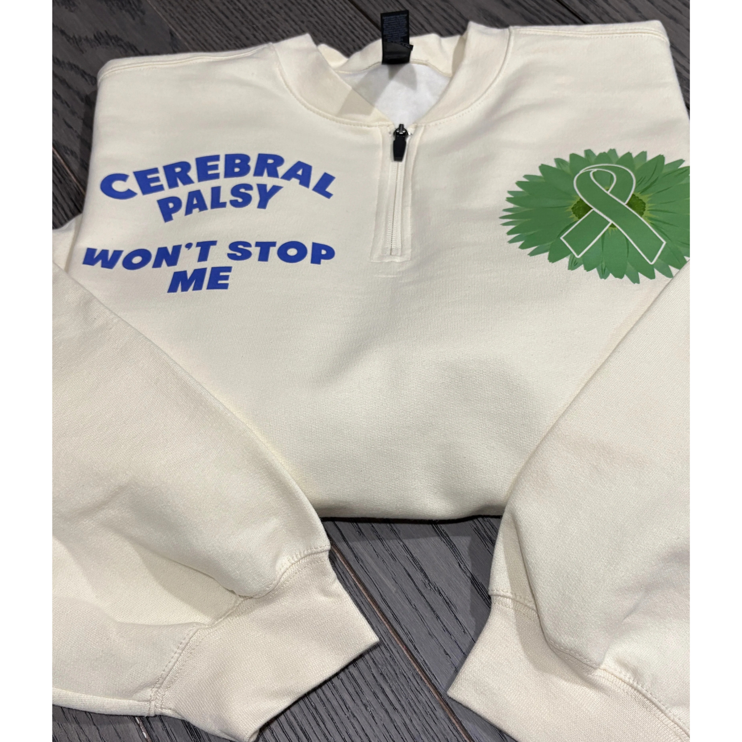 White Quarterzip sweatshirt with DTF print Cerebral Palsy won't stop me on right chest and green flower and ribbon on left chest
