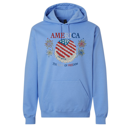 Blue hoodie with 'America' 250 years of freedom and an American flag designed cake  all embroidered on the hoodie. 