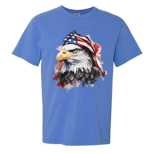 Blue t-shirt with an eagle wearing an American flag hat on a white background