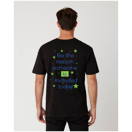 Person wearing a black t-shirt with a message on the back, Be the reason someone is included today.