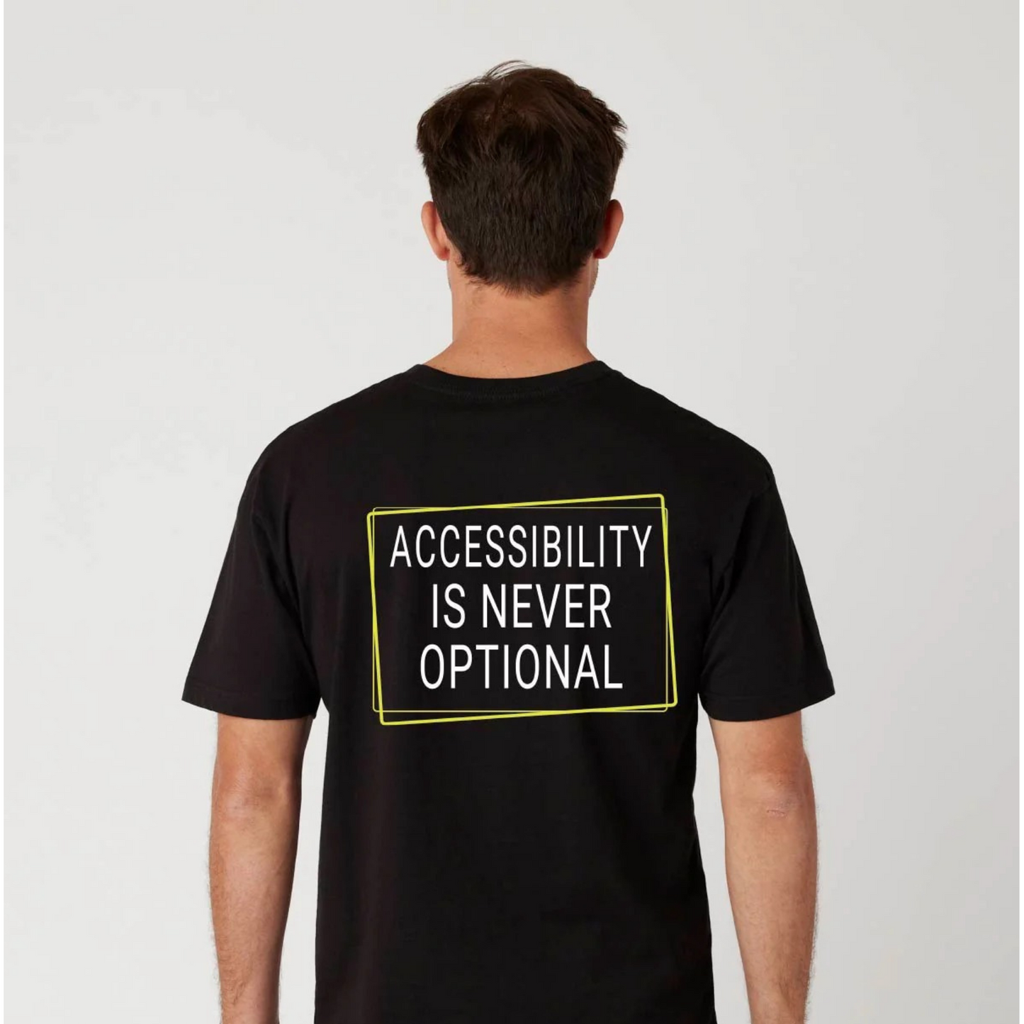 Person wearing a black t-shirt with 'Accessibility is Never Optional' text on the back.