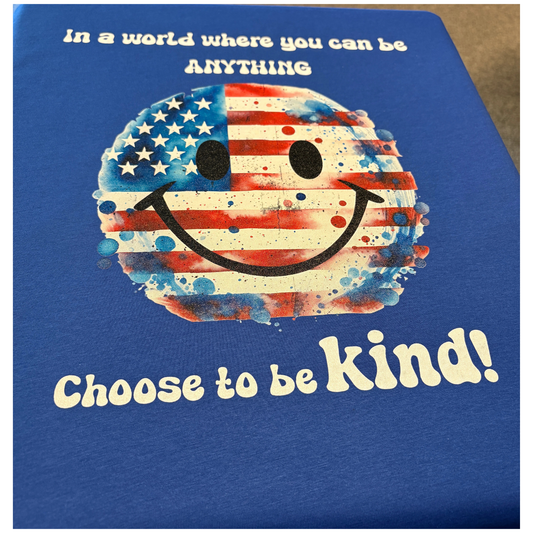Blue sweatshirt with a smiley face design featuring the American flag and text 'Choose to be kind!' on a blue background.