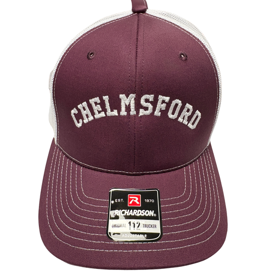 a maroon richardson 112 hat with the embroidered text chelmsford in white. 