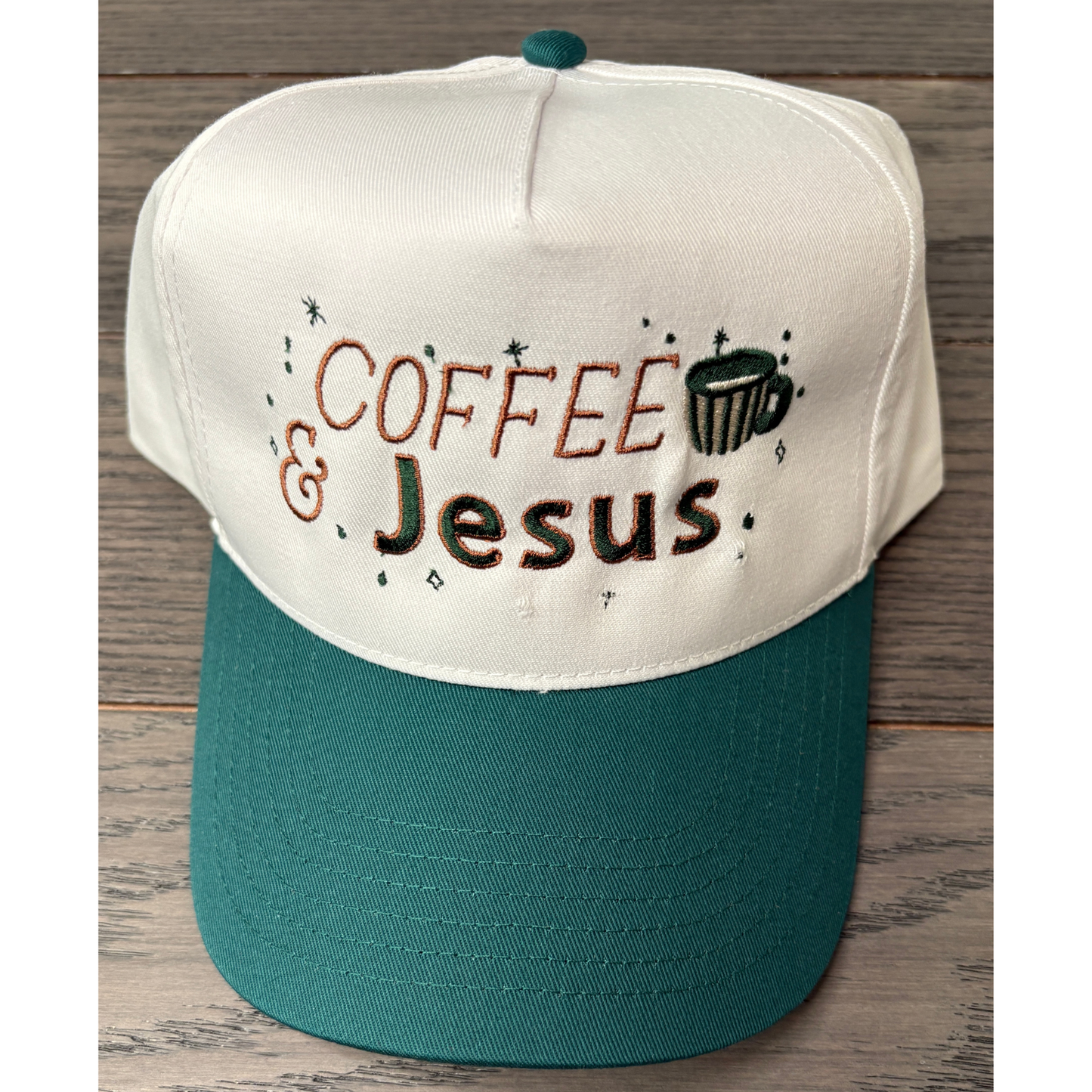 Coffee and Jesus embroidered on a two tone colored hat of naytural and green