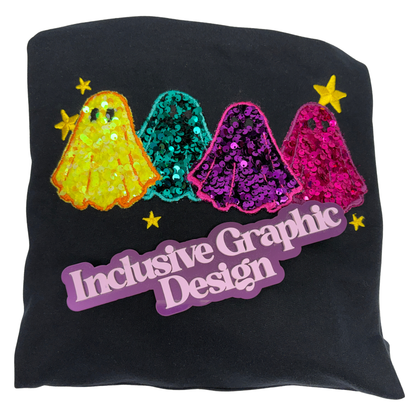 A black sweatshirt with four embroidered ghosts in sequin applique of yellow, teal, purple, and pink. A Brand marker reading 'Inclusive Graphic Design' in purple lettering sits below the emmbroidered ghosts.