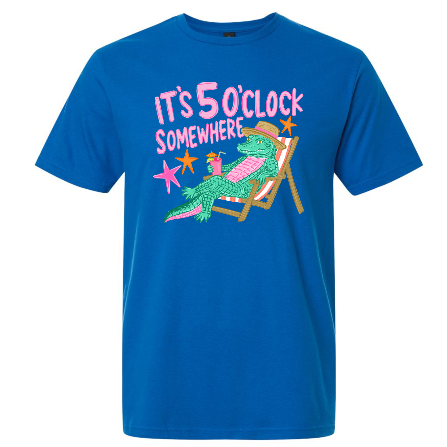 A bright blue short-sleeve crewneck t-shirt featuring a colorful DTF graphic of a green alligator relaxing in a pink striped beach chair with the text 'IT'S 5 O'CLOCK SOMEWHERE' in pink