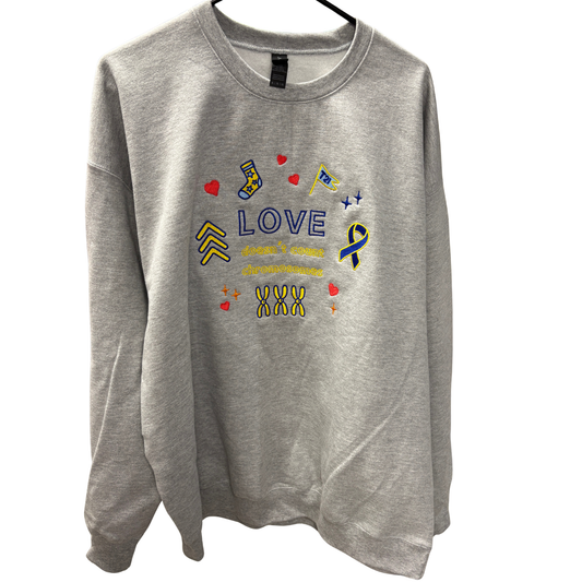 gray sweatshirt with love don't count chromosomes embroidered with different symbols for down syndrome meanings