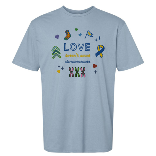 Light blue t-shirt with colorful graphics and text on a white background