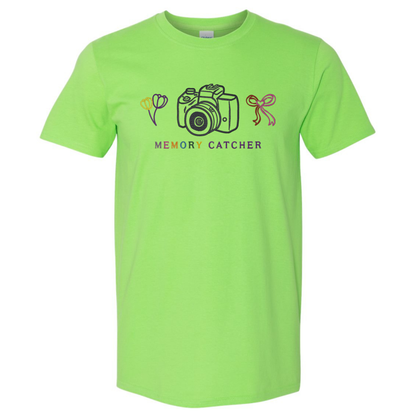 Lime green t-shirt with camera and flower graphic and 'Memory Catcher' text on a white background