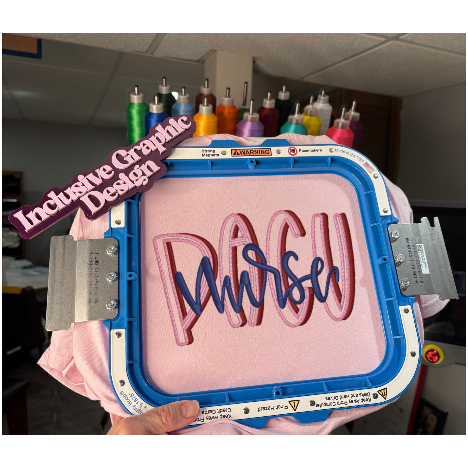 Embroidery hoop with 'Navy Nurse' text on a pink fabric, with 'Inclusive GraphicDesign' text overlay.