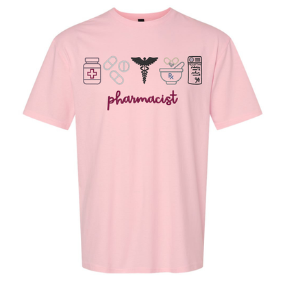 Pink t-shirt with pharmacist-themed graphics and text on a white background