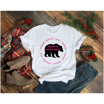 White t-shirt with bear graphic and text on a wooden surface with festive decorations