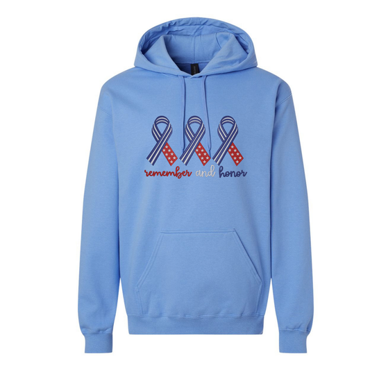 Blue hoodie with ribbon design and text 'remember and honor' on a white background