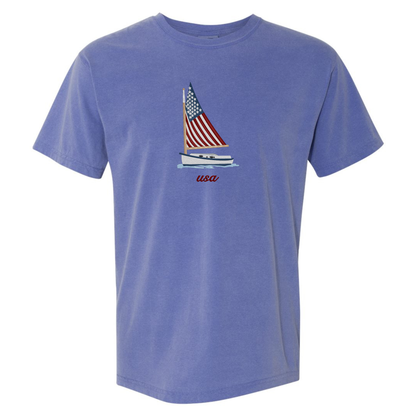 Blue t-shirt with a sailboat and American flag design on a white background