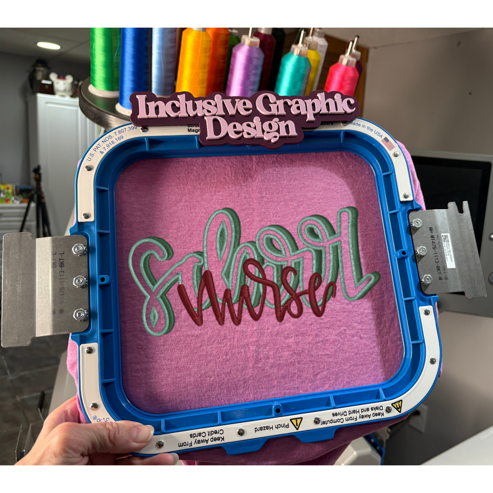Embroidery hoop with 'Inclusive Graphic Design' text and colorful thread spools in the background.