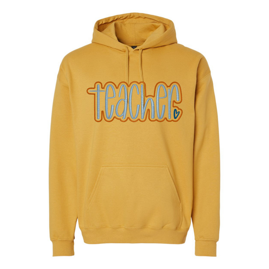 yellow sweatshirt with teacher appliqued on it