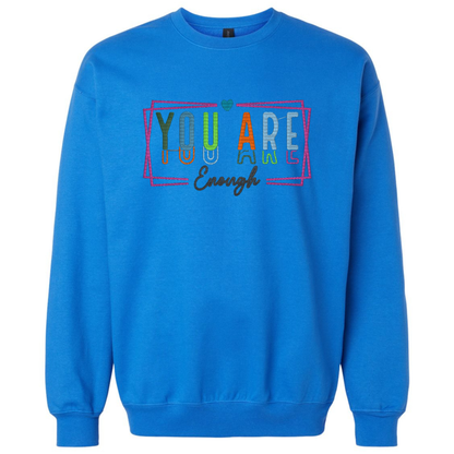 Blue sweatshirt with motivational text design on a white background