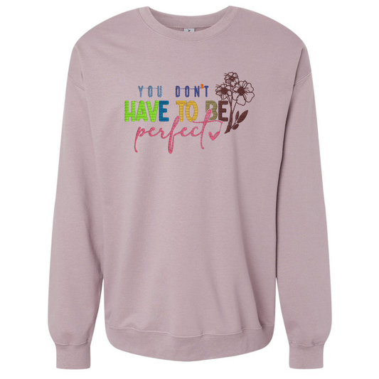 Pink sweatshirt with motivational quote on a white background